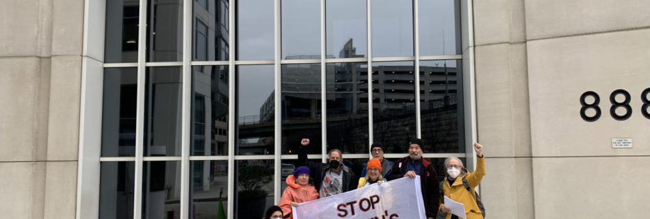 A group holds a stop Manchin's FERC banner outside the Federal Energy Regulatory Commission