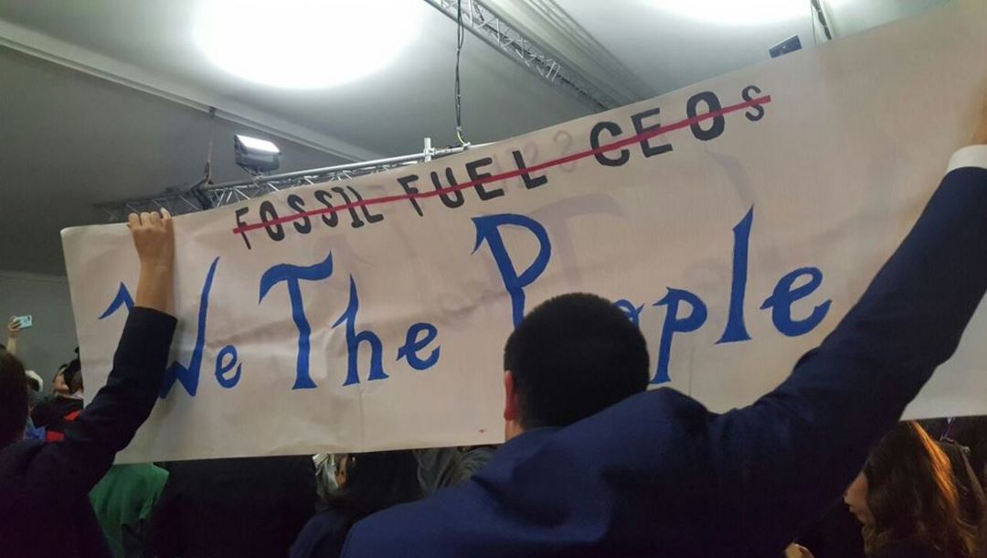 We the people not Fossil Fuel CEOs banner